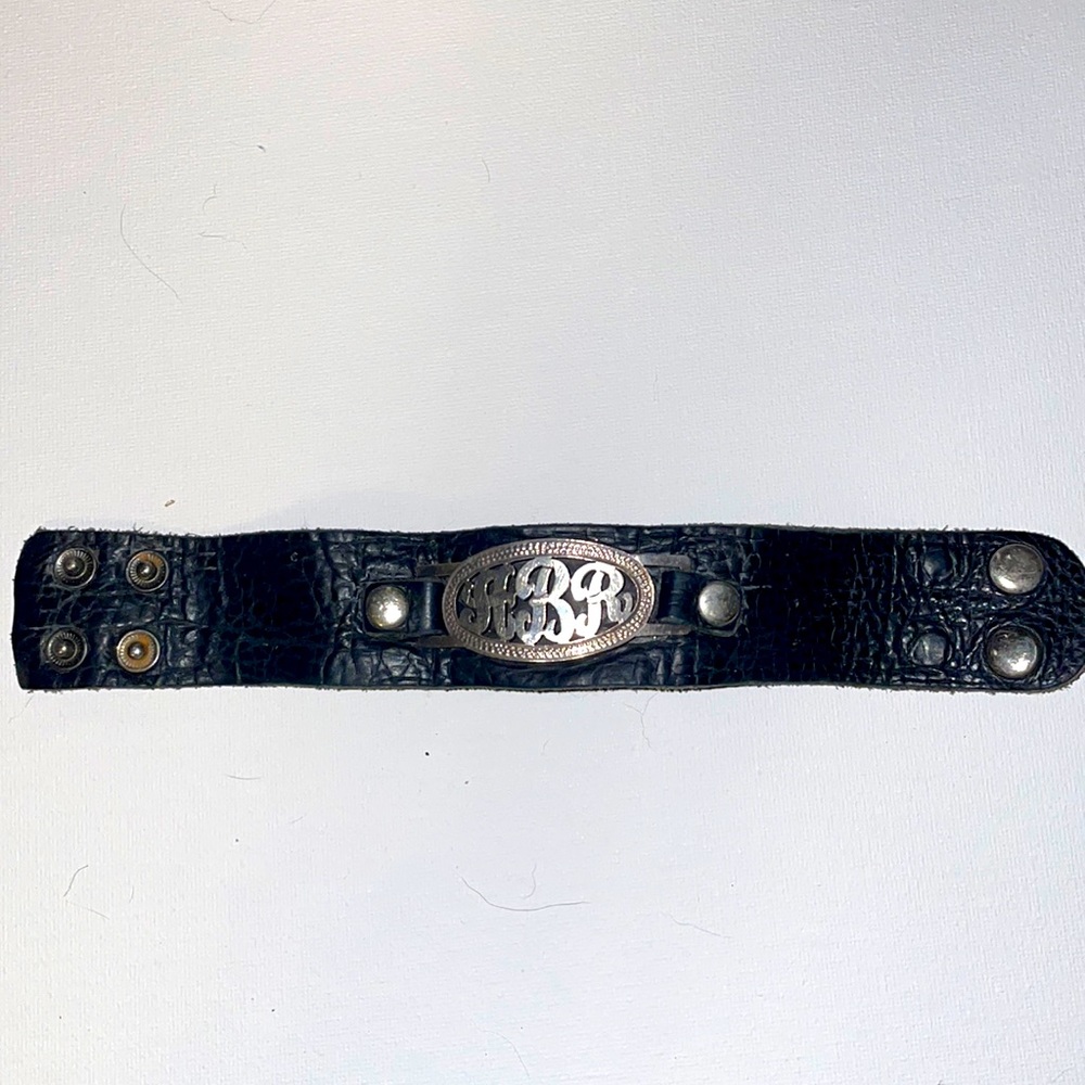 Leather bracket with initials “ARB”